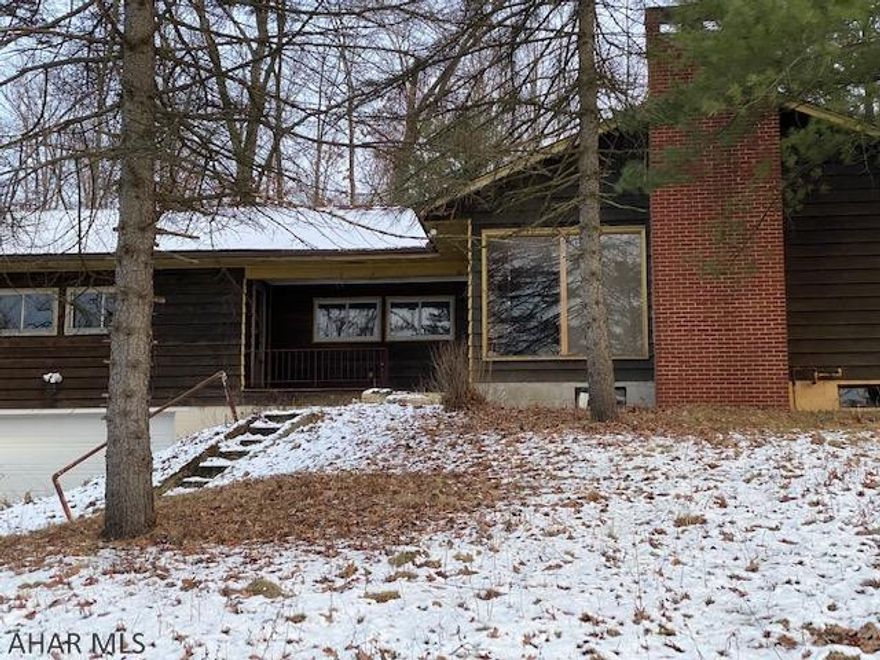 5.87 WOODED AC. with wildlife, near I-99. Live Now-Build Later! 4850 sq ft  3-5  bed ranch with 2 ba, hw floors in liv & din areas, fp, many closets & storage, lg garage plus off street parking. Drywall basement for Rec rm.  Near Logan Towne Center Mall, this growing area, with access to I-99 and Business zoning, is ideal for In Home Business, building or sub divide. Great potential value increase as area is developed. New 200 amp electric and plumbing. Six I beams and plaster walls sturdy! Separate entrances and stairways and 2nd furnace allow easy conversion to duplex or triplex. Extend drive to kit/din side door for handicap access. Many options. A large portion of value is business zoned acreage. retro kitchen. Listing agent, a PA licensed Realtor, is part owner.