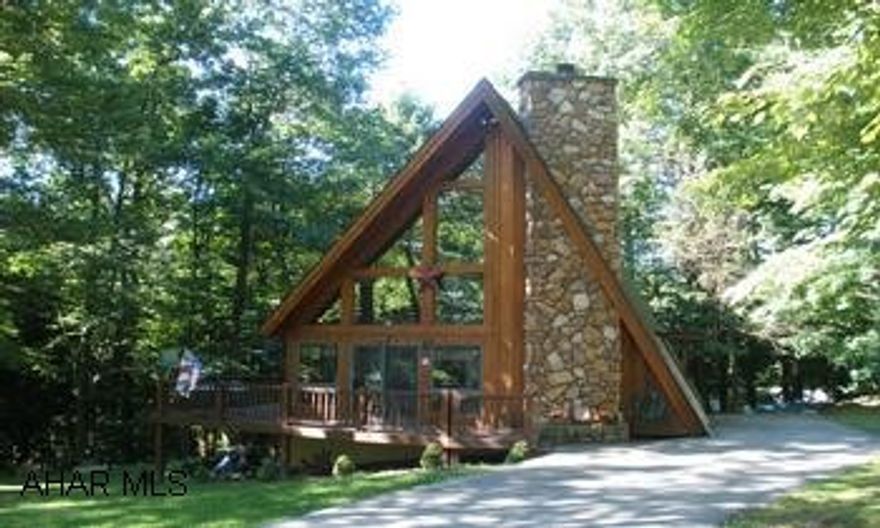 Large A frame with loft and large stone fireplace. Large A frame in Glendale Yearound. Gated community. Large stone fireplace. 1 gas fired and 1 wood fired fireplace. Finished basement. Prequalified buyers only.