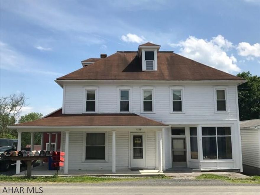 Fully operational 3 unit apartment building. Utilities separate by unit. Large recreation/community room with laundry facilities. Lots of opportunity with this property. Multiple outbuildings could be storage unit income. Front and rear parking, a ready to go income producer!