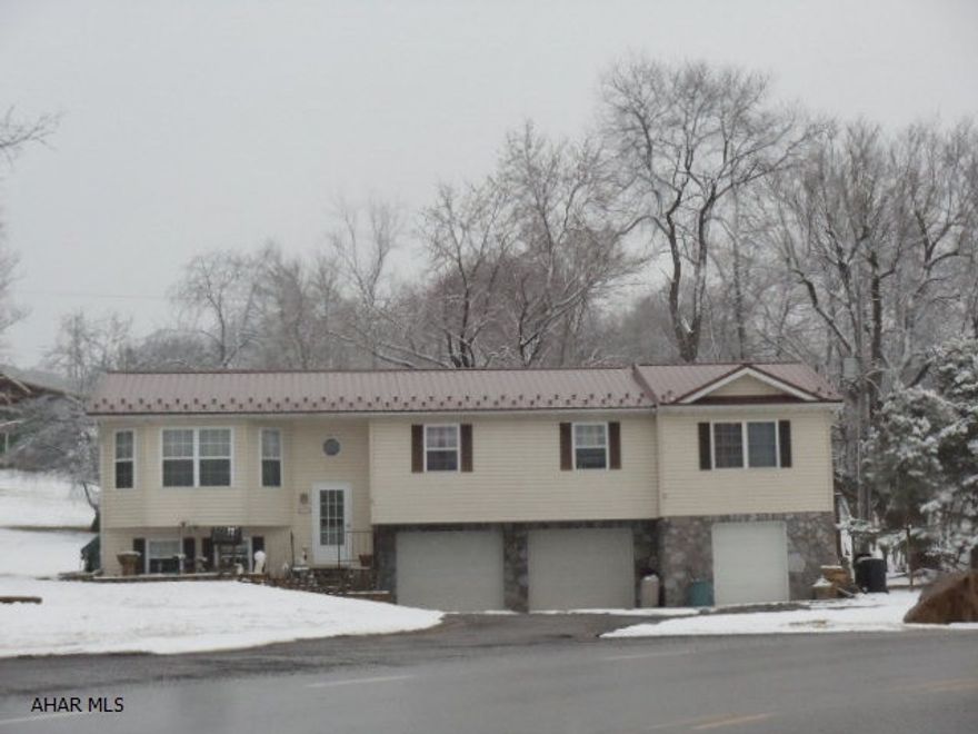 5 bedrooms, 2 and 1/4 baths. 2.5 car garage. Screened porch. J-117.