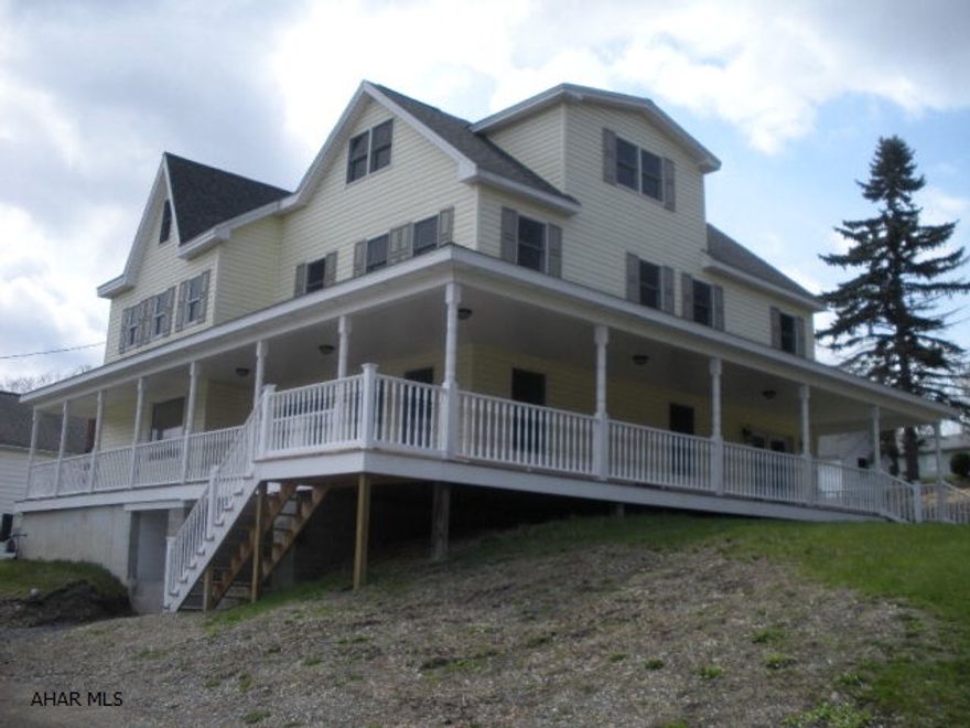 Recently renovated 5 bedroom 4.5 bath home in North Altoona, this large home sits on a corner lot, the wrap around covered porch is a great place to welcome guests.  Stepping inside you will find new flooring throughout, brand new hickory kitchen with granite counters, stainless appliances, breakfast bar and under cabinet lighting.  There is a first floor laundry and bath.  The dining area is open to the living area and kitchen.  The master suite has a large full bath with soaking tub and separate shower.  The 3rd floor has 2 bedrooms, one with a private bath.  This home has central A/C and a large unfinished basement that has 1/2 bath and a walkout to a covered porch.