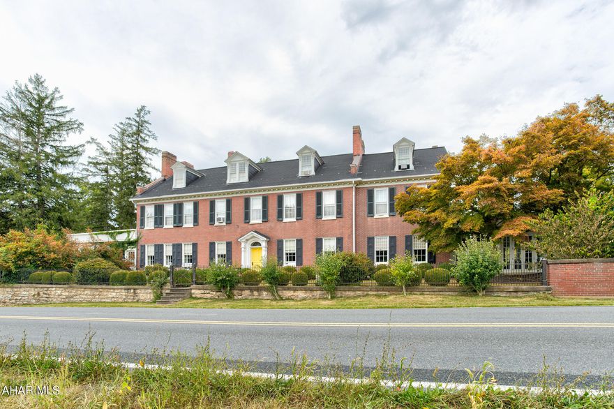 Welcome to one of the most spectacular event venues in the northeast!  This complete turnkey business is part of a thirteen acre estate nestled in the scenic Juniata Valley.  Less than an hour from either Harrisburg, or Penn State University in State College, this beautiful property includes two historic homes on separately deeded parcels, complete with furnishings, event venue equipment, multiple indoor and outdoor settings for events and activities, all set within a serene, stunning setting. 
The Manor is a well maintained stately brick home, rich in history and with a number of exceptional details, from the trim and woodwork, the grand ceilings, beautiful fireplaces, ceramic tile accents, attractive light fixtures, and much more.  The main floor reception hall is exceptionally light and cheerful and useful for so many types of events.  It spills into multiple rooms offering social spaces and display rooms.  A traditional and commercial kitchen provide ability to cater nearly any need. The second floor and third floors contain seven bedrooms, with a second floor owner suite that is exceptional with an owner bath, and separate reception/family room.  Walk out onto the rear patio which stretches out from the reception hall, and view a beautiful landscape and several attractive outbuildings. 'The Coup' provides two additional bedrooms and bathrooms for guests. Pair this with the home and grounds of The Wilson House and you have a complete operating wedding venue business that offers many more opportunities--only limited by the imagination. Contact for more details as there are too many to provide here!