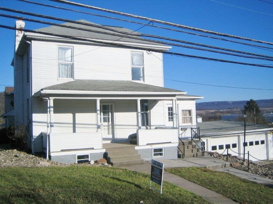 HOLLIDAYSBURG BOROUGH HOME - Nice 3 bedroom features large living room, formal dining room, first floor laundry and 1/2 bath. New carpeting and fresh paint throughout. Newer bath, thermo windows, central air and updated mechanics. Semi-finished basement, large 2 car attached garage w/openers, 2 storage sheds. Great area!