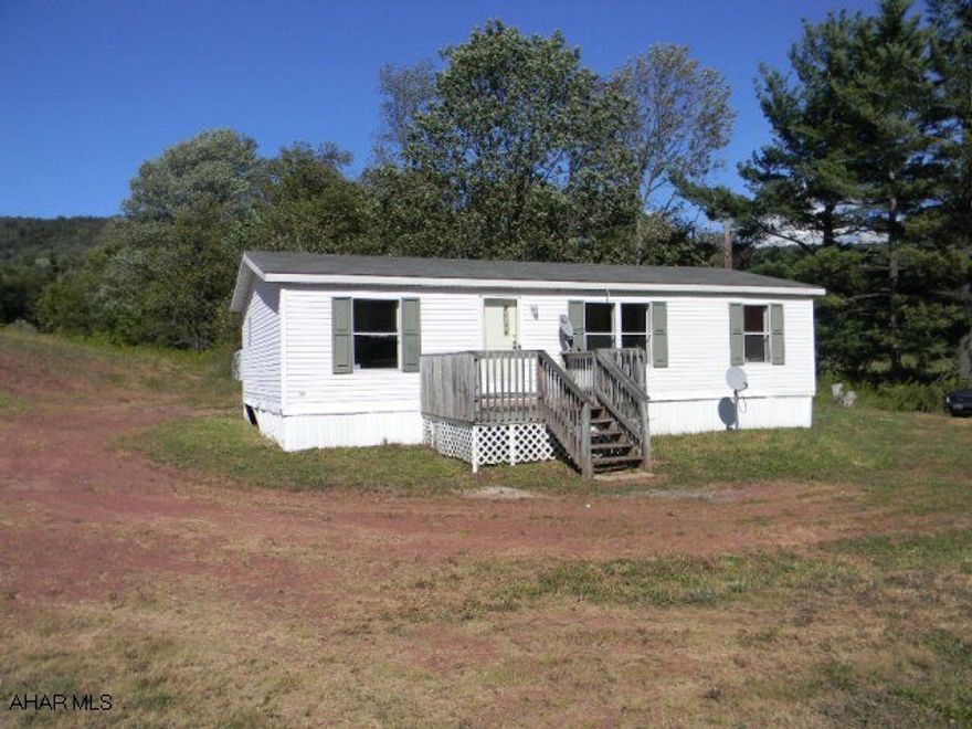 Doublewide on large, nearly 4 acre country, semi-private site. Large living room, eat-in kitchen, 3 bedrooms and 2 full baths are just right for a young and growing family. Being offered As-Is!