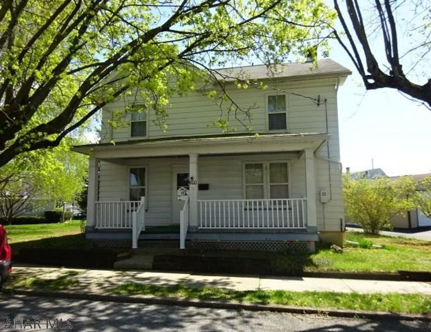 2 story home in nice area of Roaring Spring. Extra lot included. Front and rear porches, Appliances in home stay but are not warranted. There is some old knob and tube wiring still in use in house. 60 amp fuse box. House is being sold as is. Will not pass for FHA, VA or USDA.