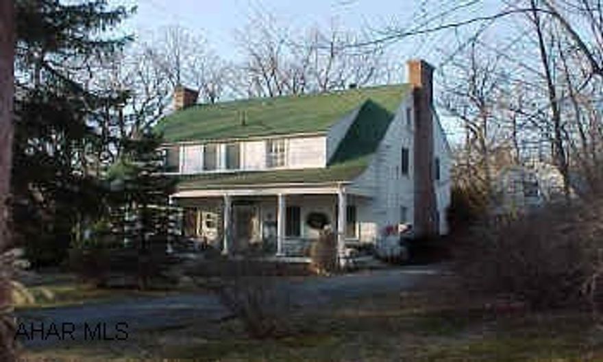 Good family home one block off Logan Blvd. Includes home and one acre lot only.   Detached garage include finished loft.