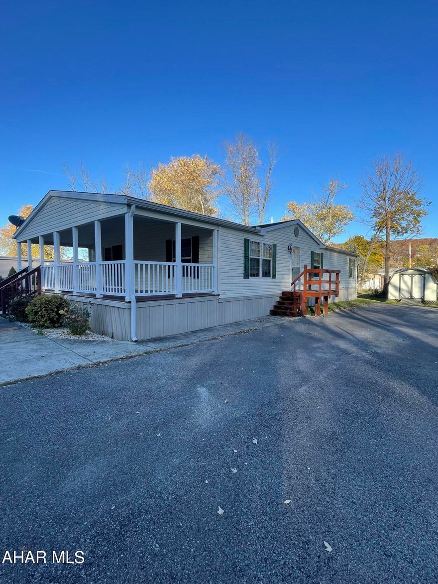 Welcome to this charming 2007 manufactured home in Lakemont, Altoona, located on a peaceful, rented lot.  This spacious residence offers 3 comfortable bedrooms and 2 full bathrooms.  Offers a large, open kitchen with ample counter space and cabinetry--perfect for cooking enthusiasts and entertaining.  Situated on a level lot with plenty of off street parking, a concrete pad in the front and paved driveway.  Central air and a large covered deck are also a bonus to this property.