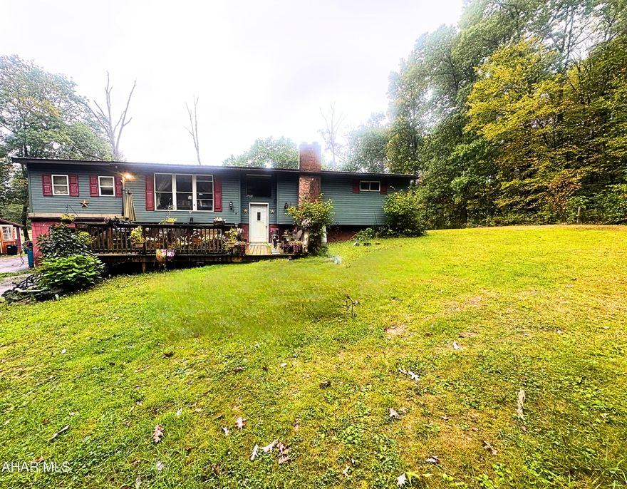 Located on a sprawling one-acre lot, this bi-level home offers endless possibilities! Featuring three bedrooms and one and three-quarter baths, this property includes all appliances and awaits your personal touch to bring it to its full potential. Enjoy ample living space, a one-car garage, and outdoor amenities like a welcoming front porch, a spacious deck, and two convenient sheds for extra storage. This home is a blank canvas ready for your creative vision.