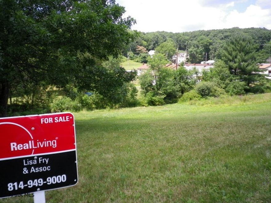 Beautiful cleared building lot with some mature trees in a wonderful quiet neighborhood of Altoona.  City utilities available.  Build your dream home on the gentle sloping ground.  A small stream with little water is at the lower end of the lot.  See survey and Driveway Permit Under Documents.
