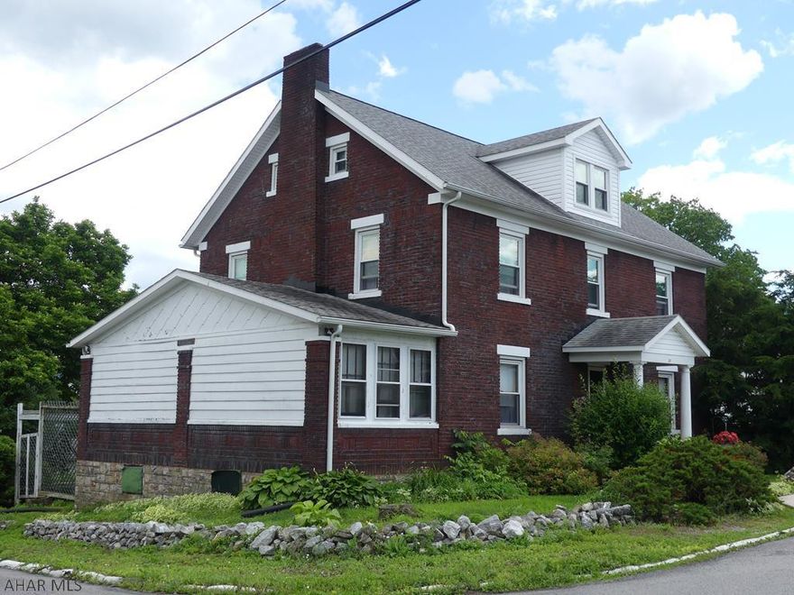 Large 4 bedroom brick home on a corner lot. Features include a detached garage, main level bonus room and a walk-up attic that could be 5th bedroom. Call for your private showing today.