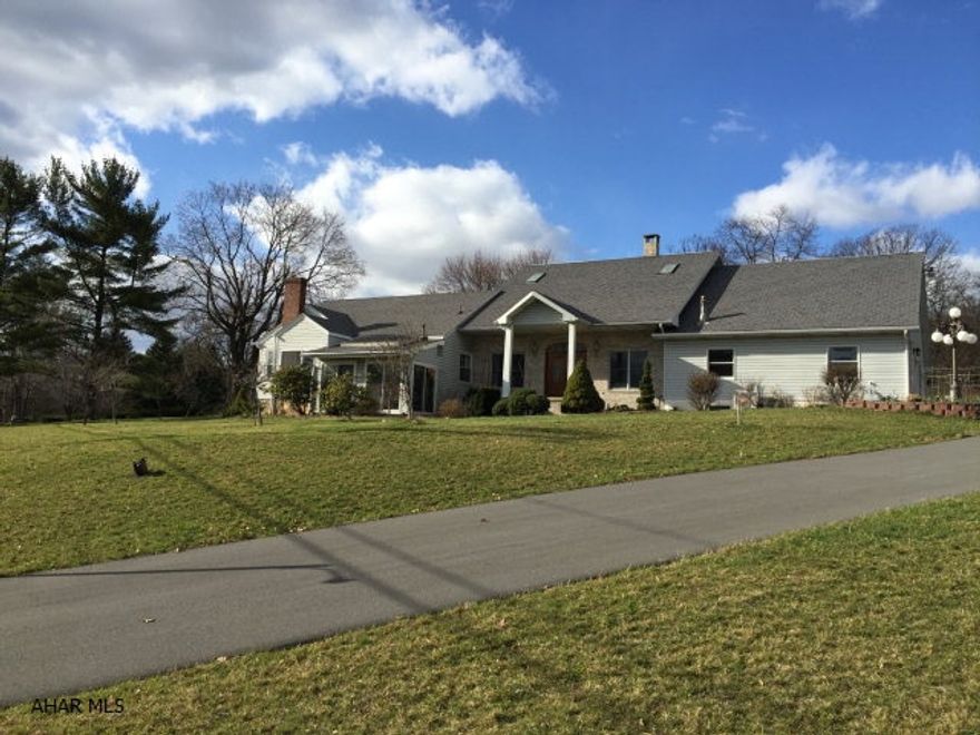 Rare find. 6 acres & close to everything! This was an older home with many updates and a huge addition. 4/5 bedrooms. 1 bedroom with fireplace could be used as an office. 2nd floor in original section is perfect for a mother in law suite. Large eat in kitchen with ceramic tile & granite counter tops. Double sided fireplace is shared with Great room. First floor family room with wood burner and first floor laundry. Large Master bedroom. 4 car attached garage and separate 2 car garage with workshop & storage above. Back patio partially covered includes built in brick oven. Above ground pool, swingset, and pond included. The main section of the basement is finished and includes a wine cellar!