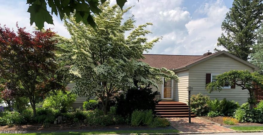 Dont Miss this One!! Larger than it appears. This beautiful well maintained 3bd 2.5 ba ranch home with spectacular curb appeal offers hardwood floors and large rooms throughout, Oak kitchen with island peninsula for additional seating, formal dining room, large Livingroom, master bedroom with updated bath with tile shower, updated first floor bath with laundry. Basement offers a large family room, large bonus room that could be 4th bedroom. Large unfinished area that could easily be finished. Outside is great for entertaining boasting beautiful park like flower gardens, a large unique deck that offers privacy, multi tiered landscaping that allows multiple patio areas on a large lot .28 acre lot. Sheds. off street parking. New roof. C/A