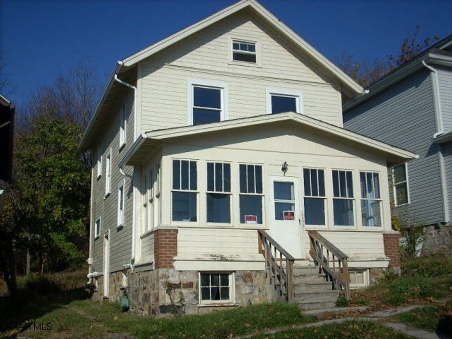 2 1/2 Story Frame Home, 3rd floor is heated.  Great investment opportunity.  Enclosed front porch, plenty of storage.
