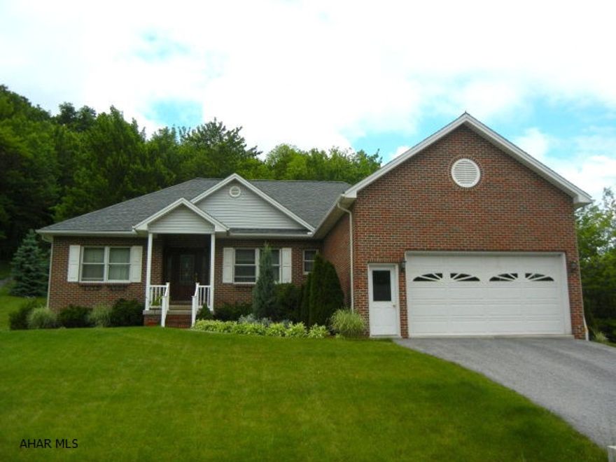 Quality construction one story. Large cherry kitchen with eat-in area along with a formal dining room, gas fireplace in living room. Also full finished basement includes (living room, office, bedoom, bathroom and kitchen w/eating area --VERY NICELY FINISHED! Very large deck off the rear of the home that faces the woods! 2 car garage. 2 zone heating system. Situated on 2.18 acres.  Seller states that square footage on main level is 1930 and finished living space in basement is 1,000 (total 2930)