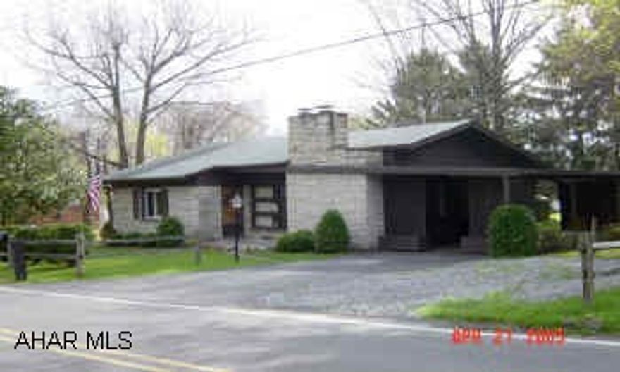 Easy 1 story living. Nice lot, hardwood floors, covered patio, vinyl floor to be replaced in kitchen. New vinyl windows. Large living room w/fireplace. Home warranty included.