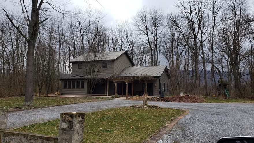 Beautifully secluded home on over 2 acres in Williamsburg school district. This home has a BRAND new gourmet kitchen,  mini splits,  fresh paint, new carpeting, new patio, and much more. The large master suite on the second floor features a full bath and large walk in closet.  The family room opens to the front patio and pond area and is perfect for large gatherings. Having a finished basement adds endless possibilities with a living room and bonus room for a 4th bedroom, office or hobby room. Outside is a  front patio, back deck and oversized 2 car garage. Call listing agent for your private tour today.