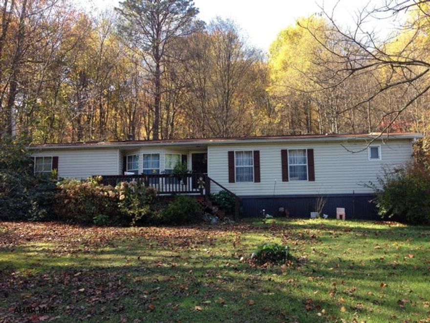 Spacious 3 bedroom, 2 bathroom doublewide with a sprawling 3 acres of land. Master bath includes a large two person tub and double sinks. Some of the land is wooded, and would make for a great outdoor gathering space. Open plan living area with large kitchen, laundry room, and bonus sunroom/sitting area. Outdoor space includes a shed and small greenhouse/shed for storage. Quiet and private in Cumberland Valley Township