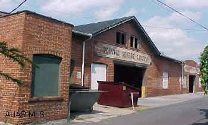 CAN NOT BE SOLD TILL 418 MONTGOMERY STREET IS UNDER CONTRACT Known as the Livery located on Cherry Alley.  6700SF 21 parking spaces in garage Livery can not be sold till 418 Montgomery is under contract. Huge room in rear of building,could be office, restaurant,retail and  has private courtyard too. Listing #6020 & 6021 sold as one. The selling price was $295,000.00. 418 Montgomery St & 306-12 Walnut St. Rear Hollidaysburg.