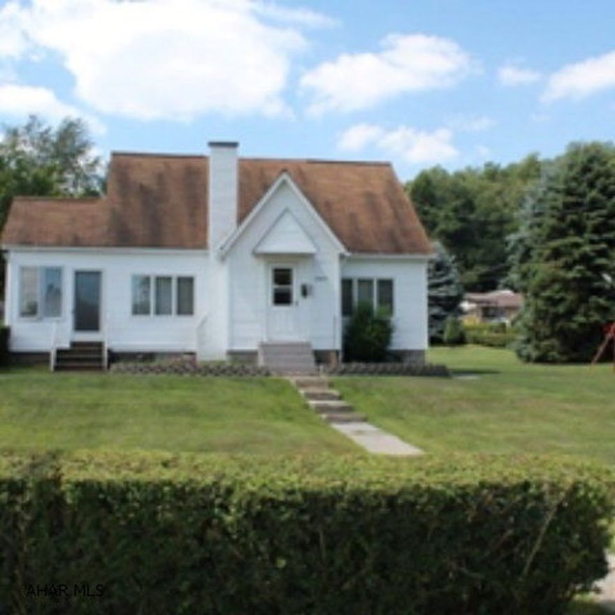 Charming newly vinyl sided home on large level lot. This house boasts hardwood floors, remodeled bath, stainless steel appliances, new windows & heated sun porch w/enclosed blinds. A 2 car detached garage. All of this and more make this house a must see! Priced to sell!