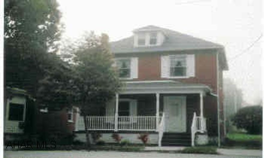 Two-story brick home in excellent condition. Newer roof, vinyl soffitt, gas heat with central air, central vac. ADDITIONAL one-bedroom loft appartment above the detached garage