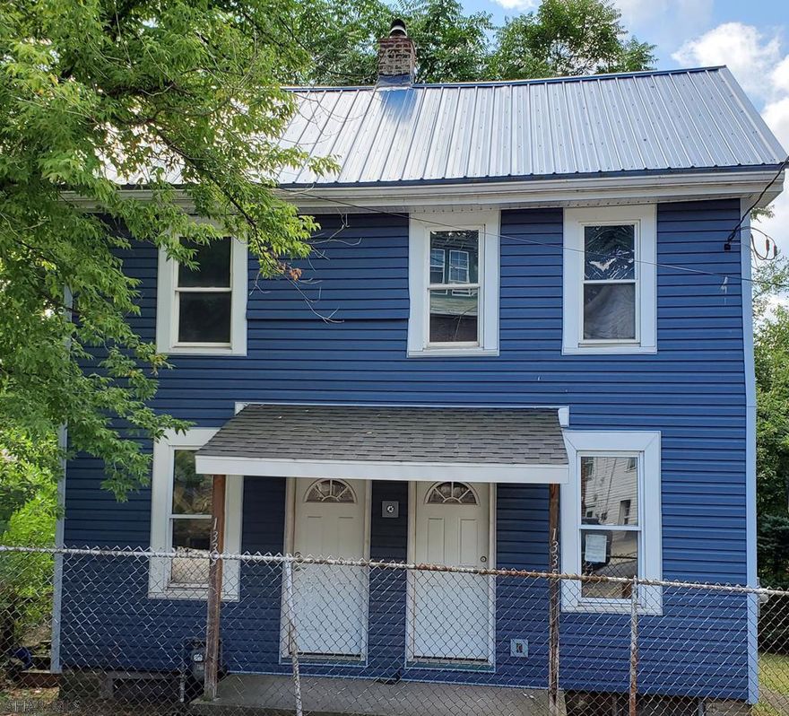 Calling All Contractors! Who wants a blank canvas to create their masterpiece?  Look no further.  This home is a duplex, but is currently gutted to the studs on the inside.  The outside has been done for you!  Just bring your vision to the interior.  It would be easily restored to a duplex as well.  Call today for your private tour.