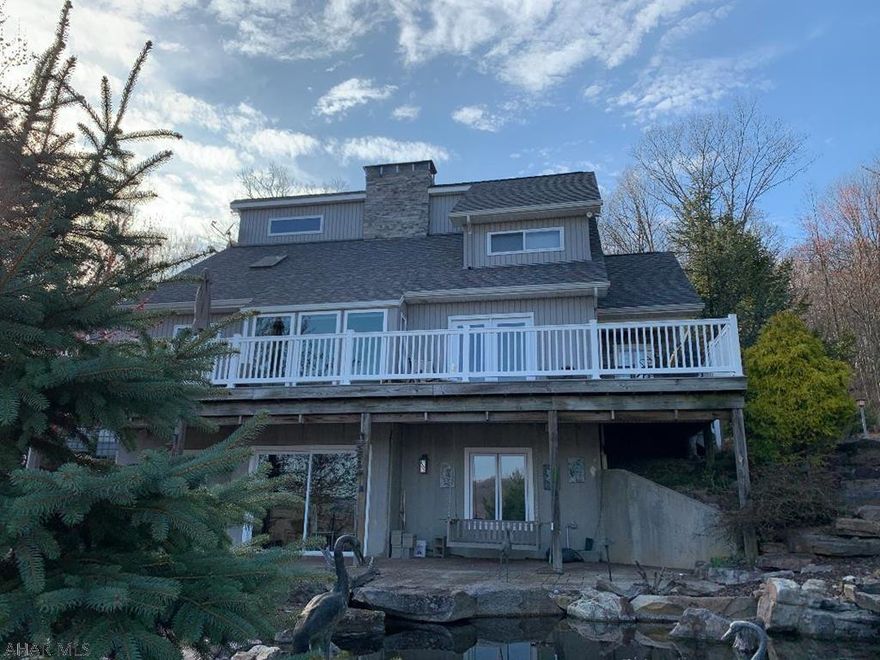 Secluded Mountain Retreat!  100.498 Acres!  Beautiful 3-bedroom 3-bath home w/great panoramic views from balcony, patio & deck overlooking pond with waterfalls, spacious 2-story garage, outbuilding & shed.  Have fun hiking, hunting or fishing on your own property which borders the Raystown Branch of the Juniata River.  Also, 9.2 miles to Weavers Falls Boat Launch.  J-509