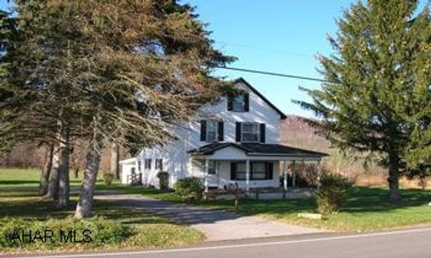 Picture perfect 2 1/2 story vinyl sided on 13+ acres. 3-4 bedrooms, 3 car garage, work shop, and much more!