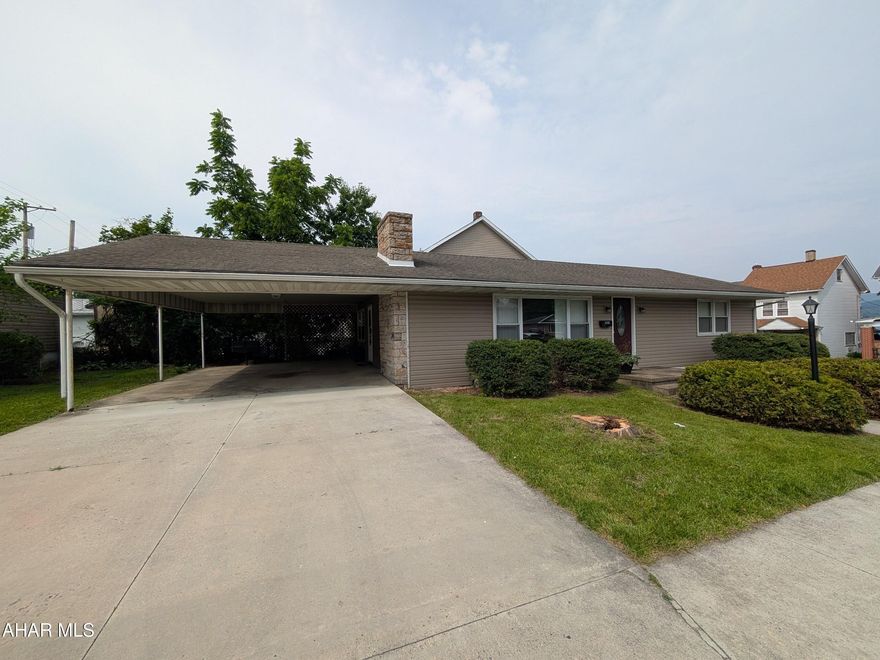 Rare Opportunity! Discover comfort and convenience in this one-story home, ideally situated in a desirable in-town Altoona neighborhood. The spacious layout features a large eat-in kitchen perfect for everyday living, and a bright, formal living room highlighted by a stunning stone fireplace—ideal for cozy evenings or entertaining guests. Two generously sized bedrooms and a full bath complete the easy, single-level floor plan. Step just a few feet from the kitchen to a covered attached carport, offering protected entry and everyday convenience. But the true bonus? An enormous detached two-car garage featuring two separate workshop or office areas—perfect for hobbyists, entrepreneurs, collectors, or those looking to explore rental income opportunities. This is an exceptional option for anyone seeking one-floor living with versatile space in a central location. Don't miss out on this rare find!