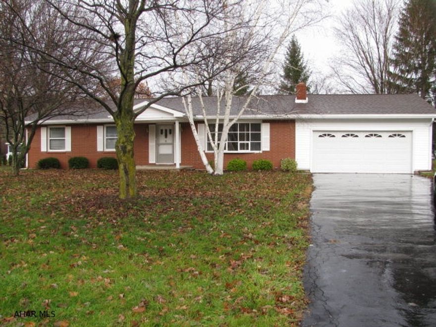 Brick & vinyl ranch in exceptional neighborhood. Quality built home with plaster walls and hardwood floors thru-out! This home offers a living room w/ stone wood burning fireplace, DR., EIK w/new flooring, 3 bedrooms all with cedar lined closets and 2 newly remodeled baths! Roof,siding,and gutters all new in 2011. Partially finished basement with 2nd fireplace! Screened porch and attached 2 car garage complete this picture perfect home!