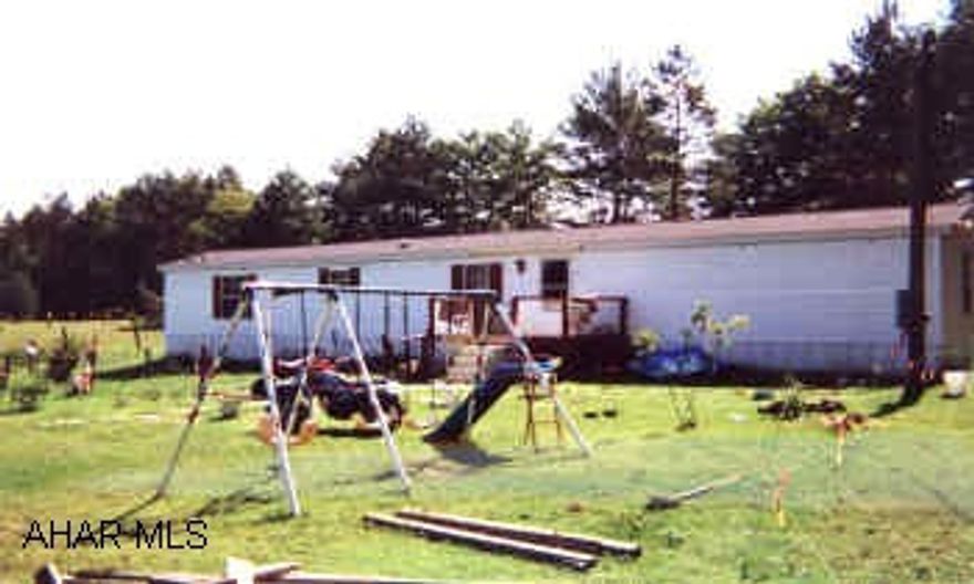 1999 CASTLE MOBILE ON 1-ACRE COUNTRY. GREAT LOCATION. DRIVEWAY TO BE INSTALLED TO MOBILE. EXCLUDED: BARN, FENCE, DECK, DISH, OIL TANK, REFRIG
