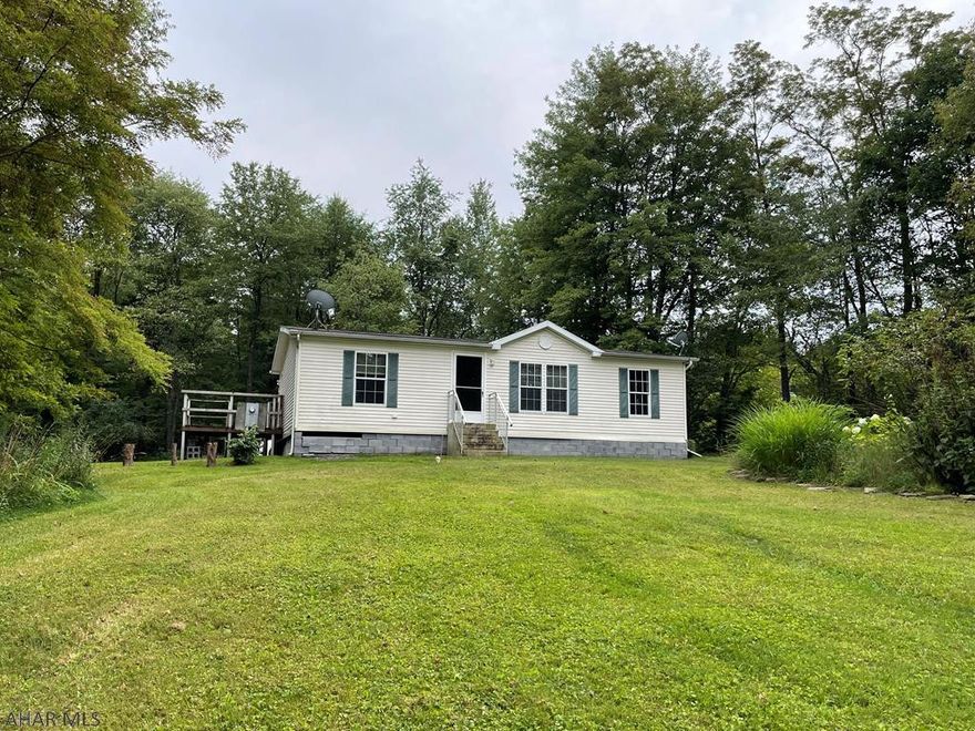 If you are looking for a quiet place in the country, this is the one for you. This home is sitting on two parcels with a combined total of 3 private acres. 3 bedrooms 2 bathrooms, new flooring in kitchen, laundry and master bathroom area. Appliances are included. One shed included. One shed included. There is an additional outbuilding/cabin on the property that will possibly need to be torn down, use caution when viewing property. Call today to schedule your showing.