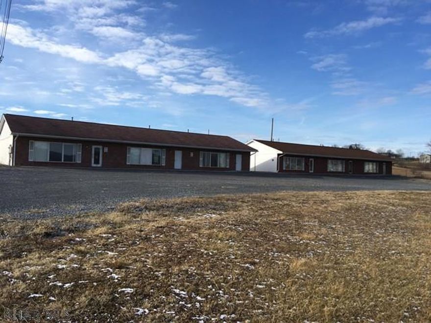 2 Brick/block large office buildings equipped each with a kitchen, handicap assessable, propane heat and  3  heat pumps per building,  and 3-4 entrance doors. Building 5157 is approx. 5440 sqft , multi-offices, conference room with downstairs storage and additional offices. Building 5139 is approx.4796 sqft, multi-offices and bathrooms (handicap assessable) and conference room (no Basement).  220 Volt equipped. Year around access and a 3 bay garage for additional storage.  Gravel parking lot with plenty of parking.  City water and sewage.