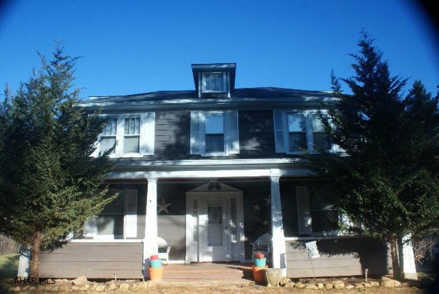 This is a beautifully decorated 2 story home between Bedford and Cumberland Md.  The large country kitchen over looks the deck and pool.  The rooms are attractively painted with unusual ceiling patterns.  The decorative trim and crown moldings add to the decor of each room.  A lot of TLC has been incorporated in the design of this property.  The large lot adjacent is ready for playing and gardening.  The gazebo add just the right touch to the pool area and there is a picnic area near the stream for those warm summer days.  There is also a half circle driveway for accessibility.   This is an older home with lots of charm and a great buy.  Don't miss this one!!