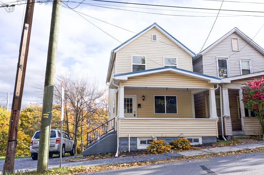 Get ready for all the updates and features this two story home has to offer! The main level is open with an updated kitchen with included appliances!  Go upstairs and find 3 bedrooms and a full bath.  The basement is finished and could be used as an additional bedroom or family room.  There is a full bath in the basement plus access to the rear deck.  The home has a metal roof plus a large parking pad that will fit 2 cars!