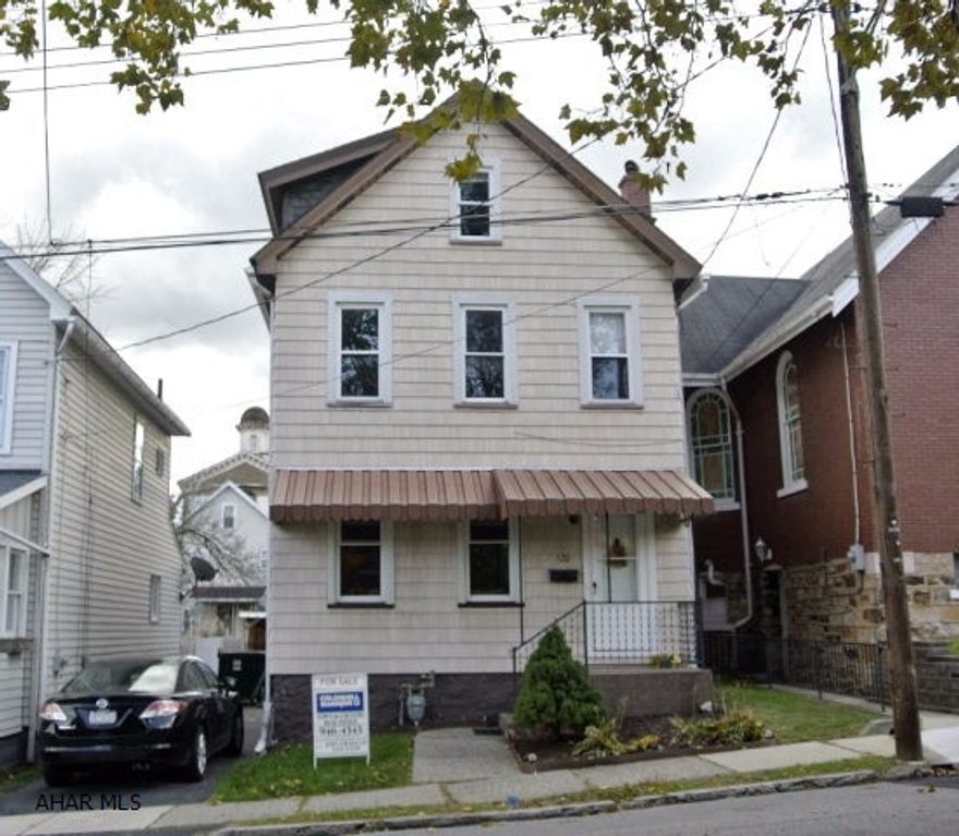Immaculately kept 2-1/2 story in beautiful Hollidaysburg borough.  Move-in ready, with updated kitchen, bath, and central air.  Newer roof.  Features off-street parking - a driveway plus a carport!  Cute fenced yard and covered back porch, within walking distance to schools, the Historic Hollidaysburg Diamond, Hollidaysburg Library, and YMCA!  Check out this charming home in a prime location!  It won't last long!