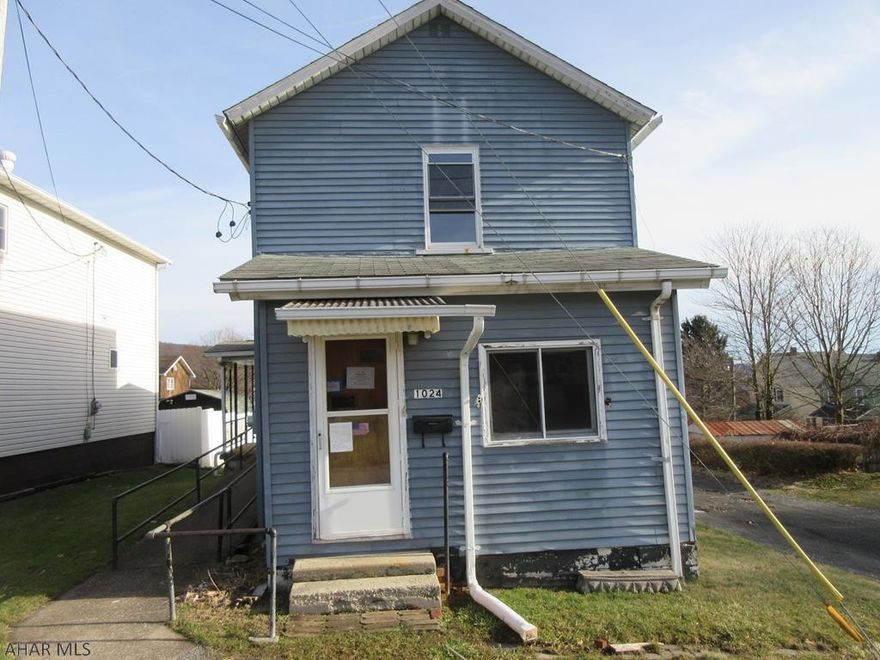 Nanty Glo 2 story home. Needs some TLC, but could be perfect for investors or handypersons. Nice sized living room, formal dining room and kitchen with first floor laundry. Nice enclosed front porch and covered side porch with ramp. Storage shed and more. Check it out!