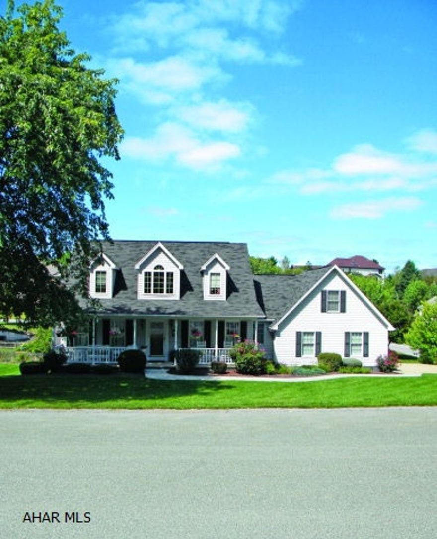 Custom built cape cod with many updates makes this a must see. Newer kitchen with cherry cabinets, granite tops, tile floor and appliances stay. The formal dining room features Brazilian hardwood cherry flooring. Don't miss the hide-a-way bonus room with skylights & private area. Fully finished lower level with custom built wet bar and an extra guest bedroom.  1 year home warranty included!