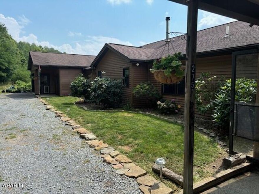 This Farmette is a Dream Come True!  All set up to be a working horse farm, hunting lodge, or quiet retreat in the country.  Situated on 10 private acres with a pond, you will find a 60' x 30' horse barn with 5 stalls, electric, hot and cold water, heated tack room and an approx 145' x 75' riding arena.  The main floor of this custom built ranch offers a large eat in kitchen with copper sink, living room and dining area with fireplace,  master suite with walk in closet, flex room used as a bedroom and a full bath with whirlpool tub.  Vaulted ceilings and pickled oak flooring are a few of the upgrades.  There is also an attached 2 car carport. 
The main floor also offers a guest suite with a kitchen, living room,/dining area, bedroom, bathroom w/laundry hook ups and walk in closet. This suite has its own outside entrance and attached garage. 
The basement offers a large family  with wood burning stove, 2 bedrooms, 3/4 bath with laundry and 2 large storage/hobby rooms.  The large covered raised back porch overlooks the 3 fenced in pastures and is a wonderful area for dining out in the summer and entertaining. Plenty of deer and turkey on this property.. 2 acres have been surveyed and perk tested for an additional home site.  Subdivision would need recorded if the buyer wants to separate it from the 10 acres.   Seller will pay for a 1 year home warranty for the buyer.
 Listing agent is related to the sellers.
Year built, square footage and taxes were taken from public records and buyer to verify
Shown by appointment only, No Drive-bys permitted