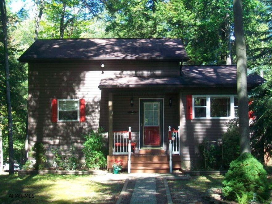 Very clean and well maintained 1.5 story used as a yearound residence. Open kitchen with oak cabenits, loft bedroom, partially finished basement with family room, laundry room and half bath. Enclosed rear deck along with open deck leading to the detached garage (storage above). Very nice home for yearound or vacation type. All amenties of Glendale Yearound available (pool ect).