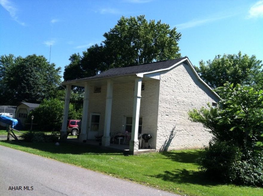 Here's a good investment property for the price!  Currently rented on a month-to-month basis.  Tenant pays $560 a month and all utilities except sewer.  The house actually has 4 levels.  The kitchen is up a few steps from the living room.  There is also a laundry area in basement with some storage space.  Property has deck off of kitchen overlooking large yard.  Property being sold 'as is' with seller making no improvements.