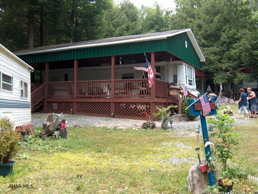 Super nice camper with pavilion & deck on a  double lot in e great area! Clean