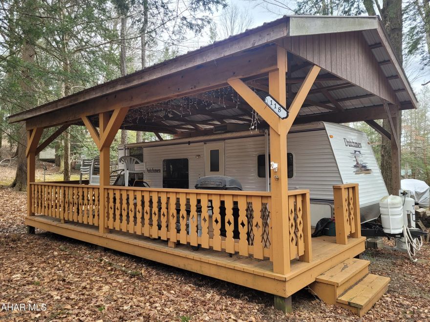 Two bedroom camper sleeps five comfortably.  Situated on a double lot and protected by a pavilion covering the camper and offering outside use regardless of the weather.
There is a new air conditioning unit included to replace the faulty one installed.

Sold as is.  Unit was working when it was purchased.  Seller has not used the camper since purchasing.