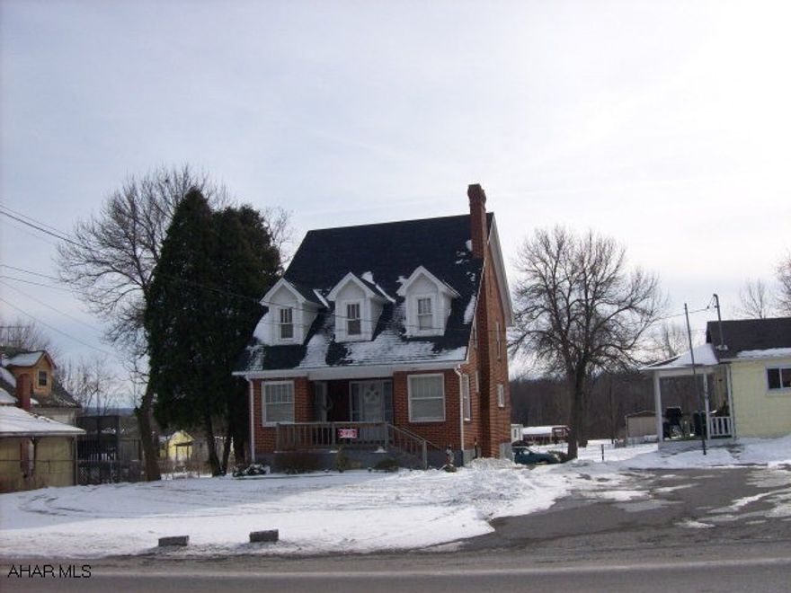 Darling brick Cape Cod on large level lot.  New shingle roof, hardwood floors, fireplace, large walk-up attic.