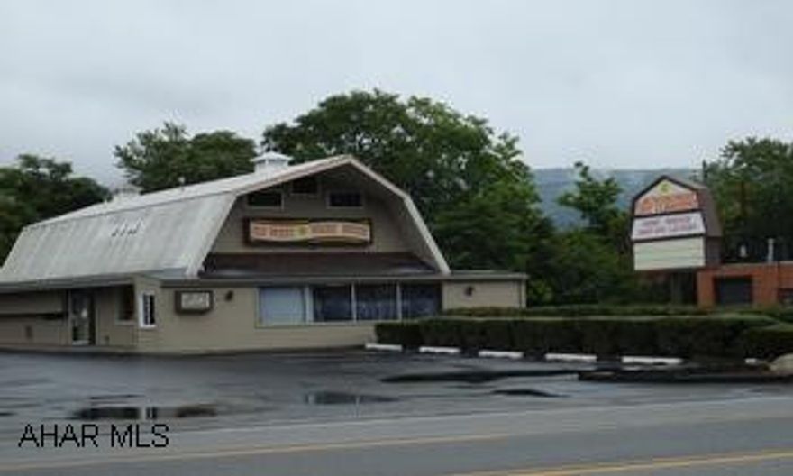 Old West Wash House laundromat. Real Estate and Business.