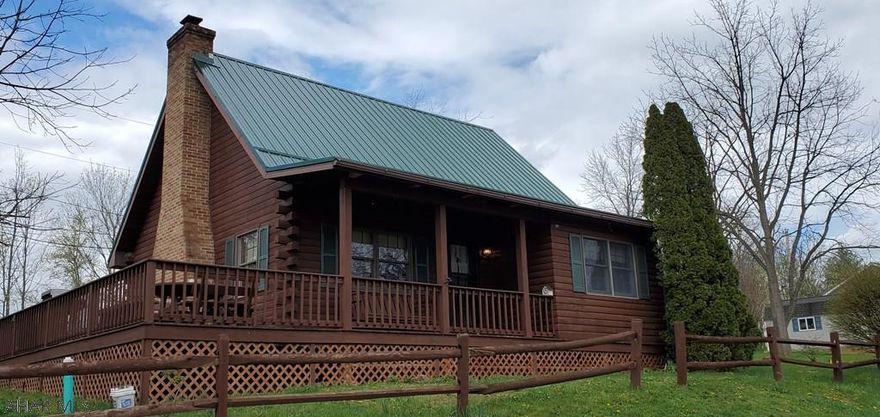 This beautiful, well maintained log home could be a full-time home or a getaway cottage.  With it's wrap around deck and screened in picnic area this home is the perfect place for entertaining friends and family.  The property is just a short drive from historic downtown Bedford and Shawnee State Park.  The homeowner is in the process of having a new HVAC system installed.  This will be completed before closing.  Patio furniture is included in the sale.