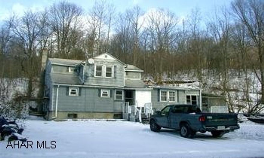 2 story older home 4 bedroom, 2.5 bath, family room, sunroom, covered patio, fenced yard, upstairs possible rental.