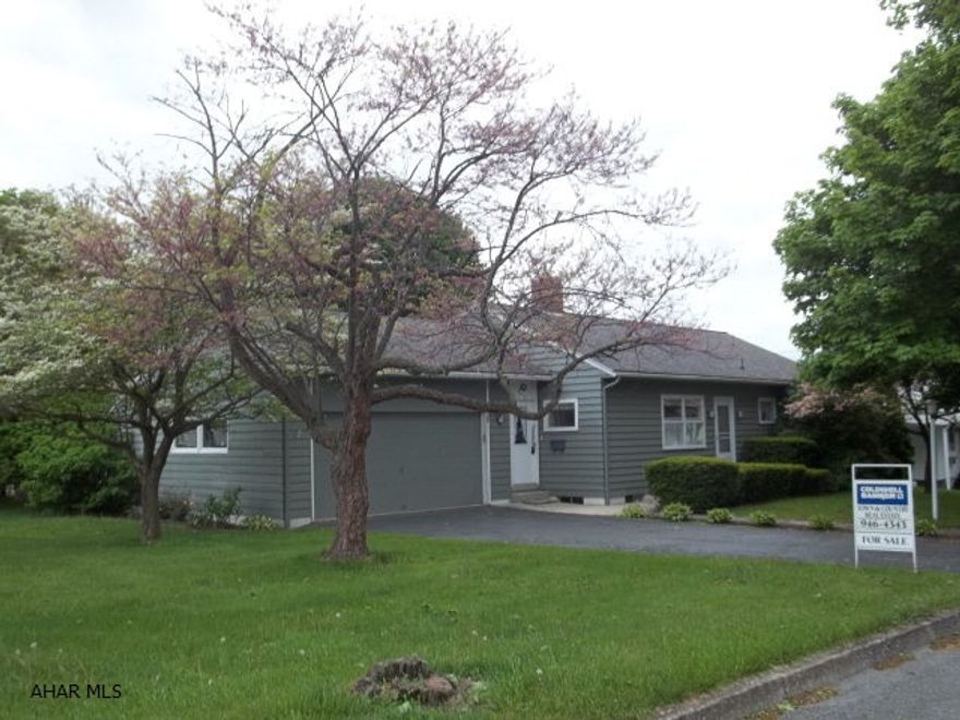 This ranch has so much potential! It sits on a super large corner lot with a 2 car attached garage, hardwood floors (need refinishing), a great brick fireplace,first floor laundry,  tons of windows, super large kitchen and beautiful mature trees, partially fenced in back yard, large shed,in a  super neighborhood.  Priced to sell - an absolute must see! Two separately deeded lots.  Adjacent lot is a buildable lot.  Live in the house and sell the lot to offset your mortgage or enjoy the extra space.