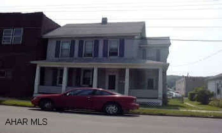 Duplex with 2+ car detached garage.  Separate utilities.  Apt 1 - 1st fl l/r, kit, bath, 2 b/r, hall - 300+util.  Apt 2 - 2nd fl l/r, kit, bath, 2 b/r, attic storage - 250+util.  Garage - 100.