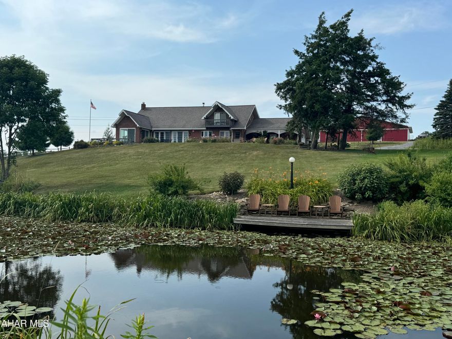 Welcome to this fabulous, serene property that will leave you breathless. This property has it all. Beautiful brick home, cabin, 2 barns, 2 ponds, 127+ acres and a dock to fish!! 
Where to start? Once you take a step into this gorgeous home you will not want to leave. The kitchen has custom cabinetry, slate floors and quartz countertops. The DR/LR has vaulted ceilings with beams from an old 18th century home! Enjoy the warmth from the brick fireplace in the winter or sit out in the 3 season room and enjoy the peacefulness and views. Home has 4 BR with one that can be used as a den, office or a 5th BR. Finish the basement for even more space! Possibilities are endless!
Take a walk to the cabin on the property as its quite stunning. Have family, friends stay in their own space or rent out to students as the University is close!! Cabin has its own wood stove, kitchen, 3BR and a claw tub!
The 2 barns on the property were restored and in great condition.
Love to fish? Take the pontoon boat out or stay on the dock. Dock has running water, bathroom, a bed and there are lots of large fish! Large pond is roughly 15'.
If you are looking for a property that has it all, look no further. This is it!
OGM is being sold with property.
Call listing agent ASAP for your tour!