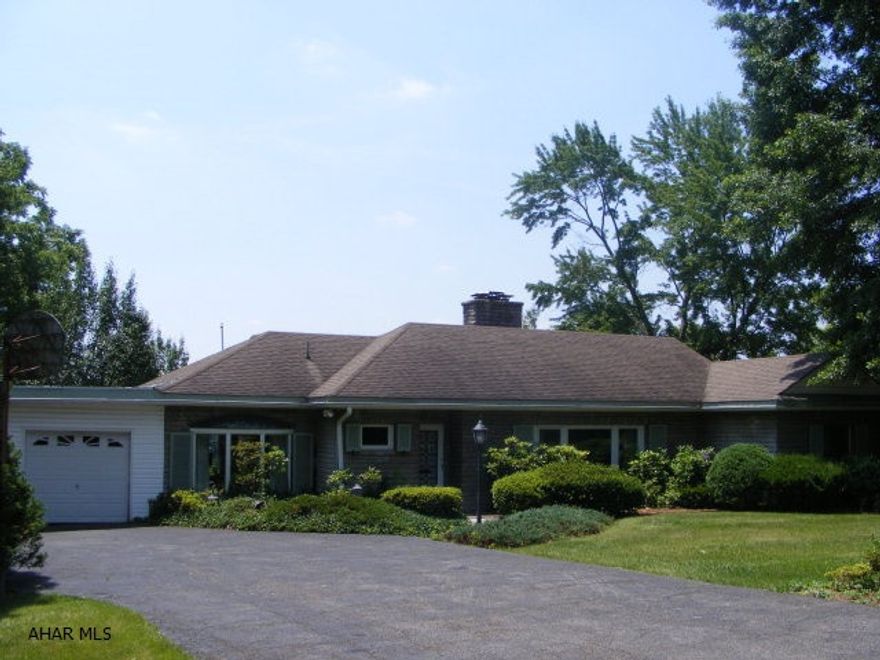 One of the best views and best location in the area! Large stone Ranch with huge Living Room, Dining Area and updated kitchen. nice den with terrific view too. Inground pool. Lovely stone patio. House and pool need TLC. Sold in AS IS condition.